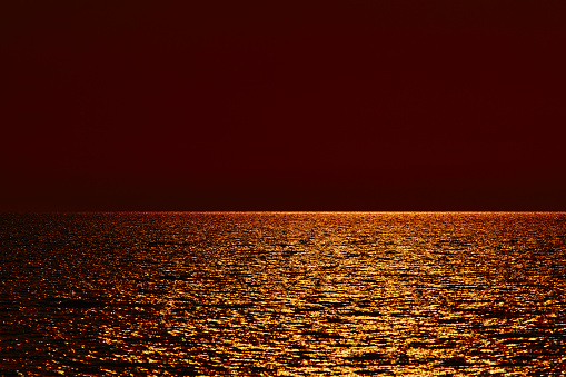 Ocean sea sunlight reflection and distant horizon.