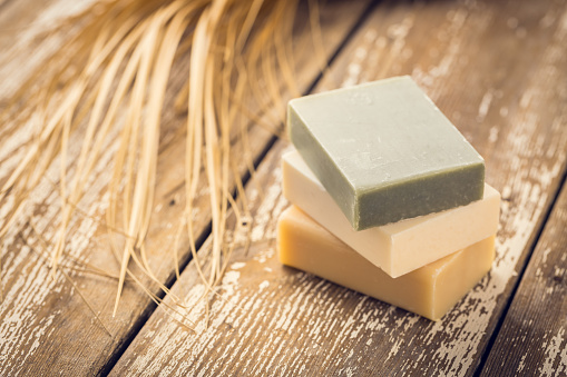 Natural handmade soap on a wooden background. Handmade natural eco soap, selective focus.