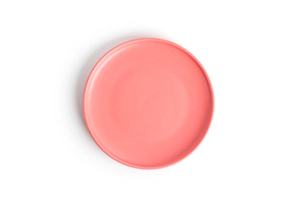 istock Pink plate is isolated on a white background 1365309722
