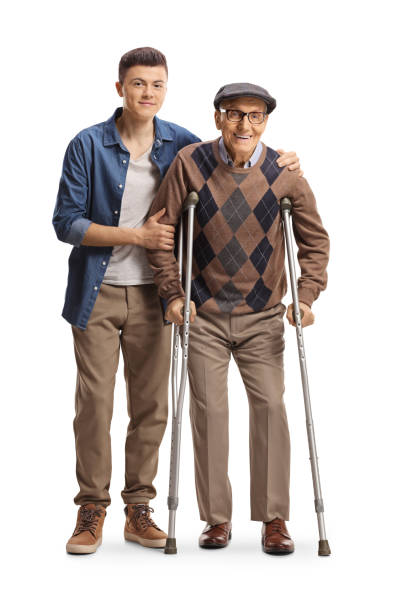 목발을 들고 걷는 노인을 돕는 청년 - men crutch isolated support 뉴스 사진 이미지
