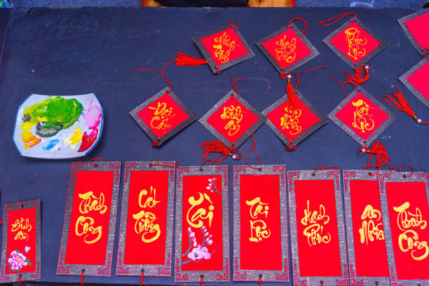 Traditional decoration for Tet holidays in Vietnamese house. red envelops and gilded decorations at New Year market. Lunar new year in Vietnam