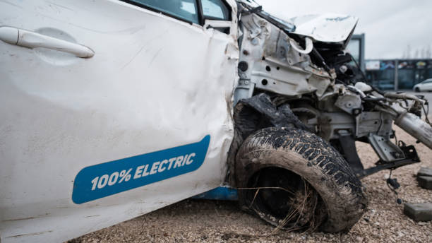 istock Crashed electric car in severe accident, frontal impact 1365311016