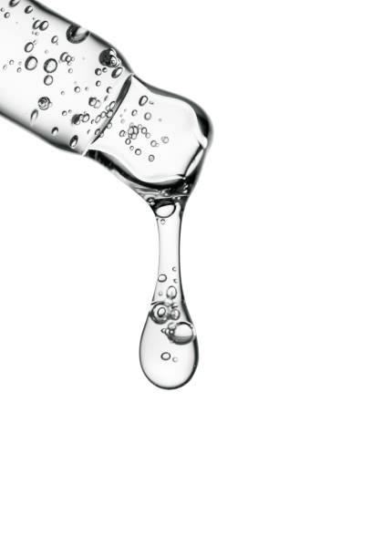 istock Transparent pipette with cosmetics on a white isolated background. 1365311471