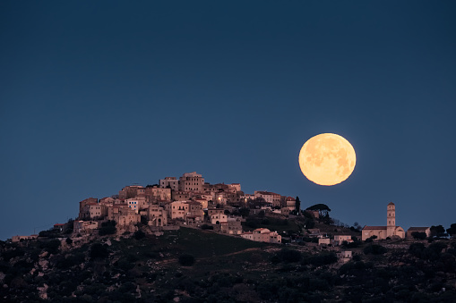 Full moon over the ancient hilltop village of Sant'Antonino in the Balagen region of Corsica