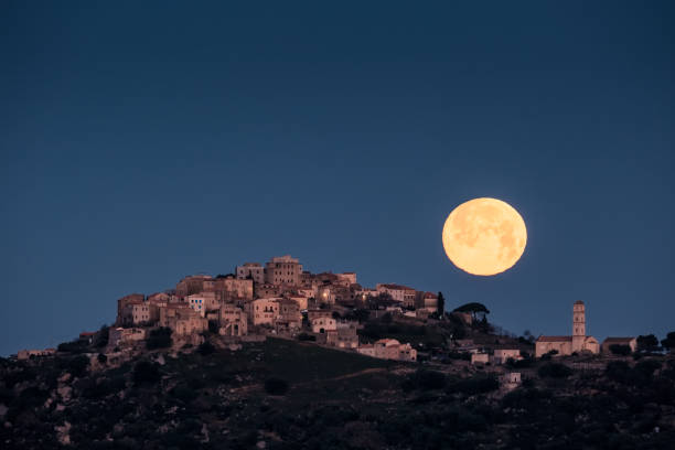 Full moon over Sant'Antonino in Corsica stock photo