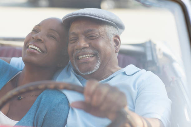 in love African American couple in their eighties and seventies, hugging and kissing, Botswana