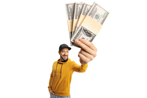istock Guy with a yellow sweatshirt holding stacks of money 1365315567