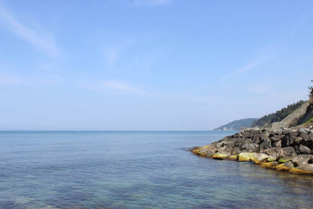 Blue clear sea, cliff and blue sky landscape