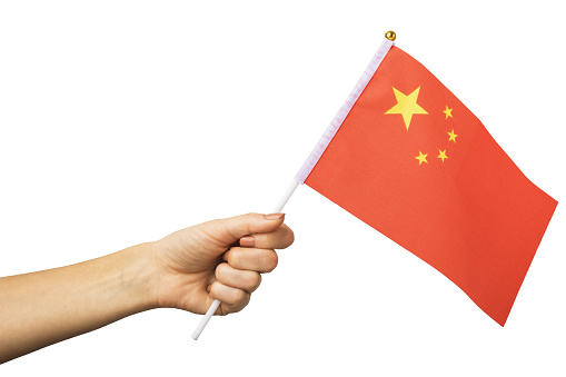 Female hand holding Chinese flag isolated on white background, template for designers