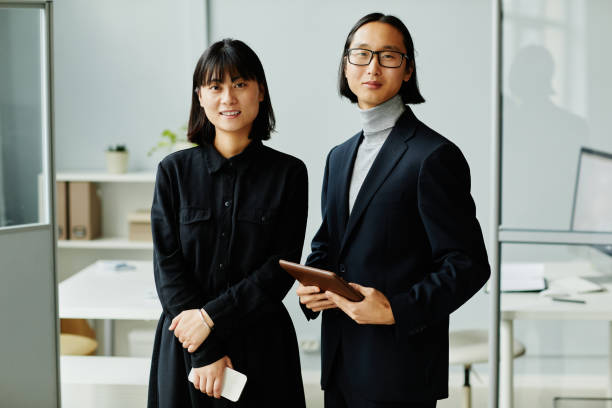 istock Smiling Asian Business People 1365320920