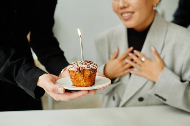 birthday surprise in office close up - cupcake birthday birthday cake first place imagens e fotografias de stock