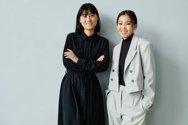 istock Two Young Asian Women Minimal 1365321012