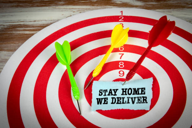 istock STAY HOME WE DELIVER. Red target with darts 1365321398