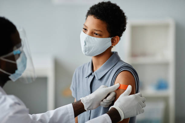 istock Girl in Vaccination Clinic 1365322596