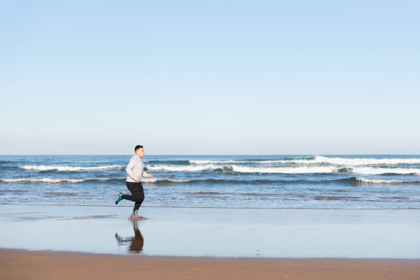 istock Latin sportive man running 1365327963