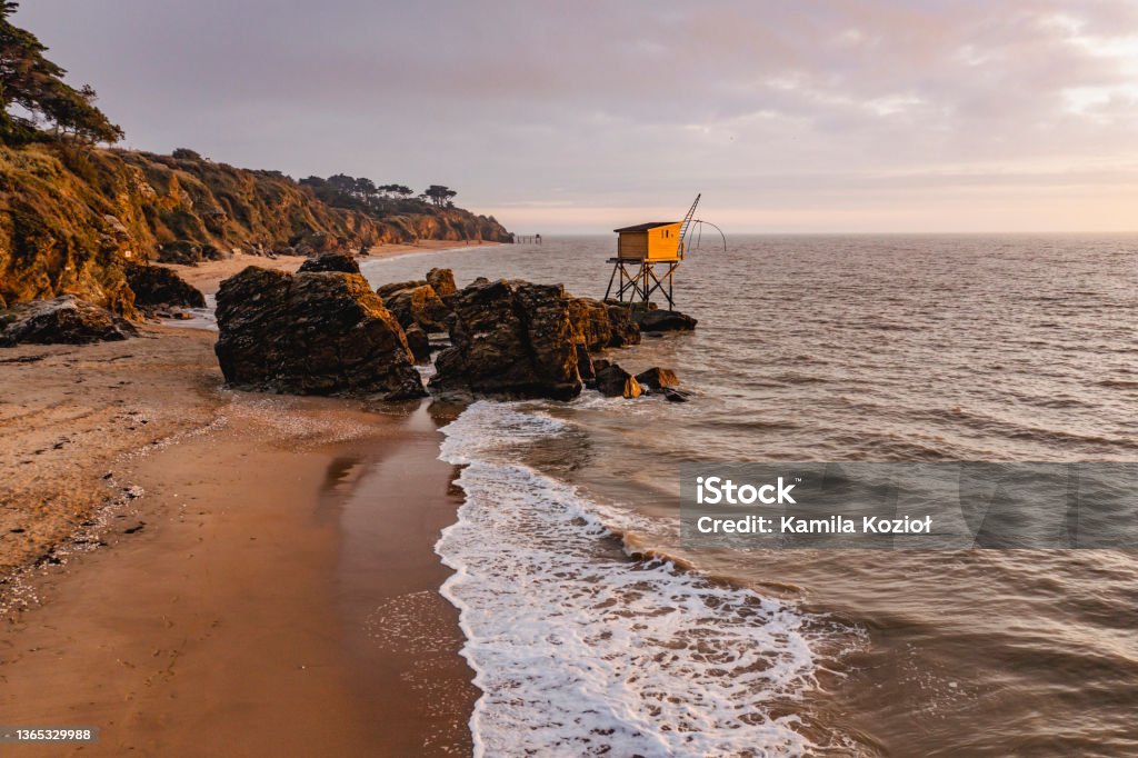 "nFrench oceanfront landscape, oceanfront fish cabins in France. Beach Stock Photo