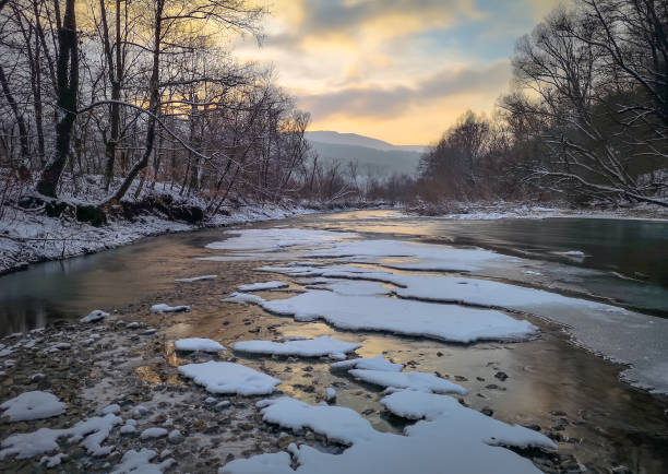 istock Evening winter landscape of a mountain river 1365331594