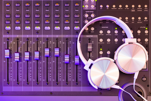 headphone on mixing console. recording concept