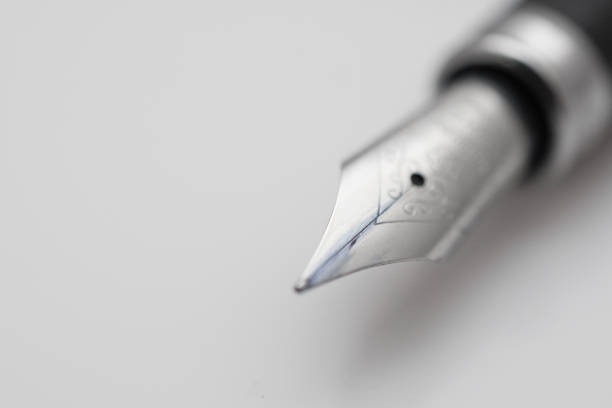 istock Black ink fountain pen insulated on white 1365335177