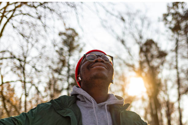 istock Shot of a man using wireless earphones while out for his workout 1365335488