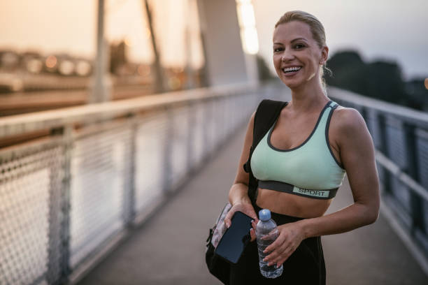 istock Women exercising together outdoors in summer evening 1365335638