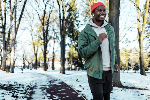 istock Active african american man running exercise workout outdoors 1365337698