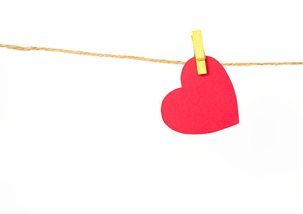 istock red paper heart with clothespin isolated on white background 1365337885