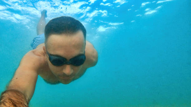 istock Man swimming under the water, Mediterranean sea 1365338141
