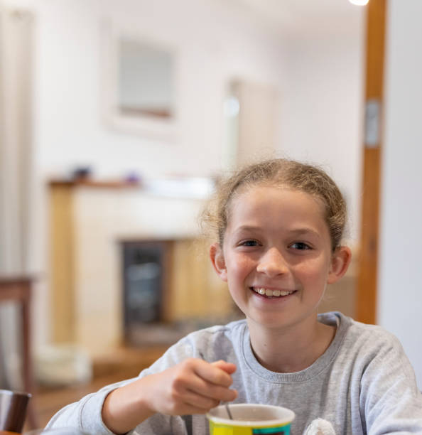Young girl eating noodles