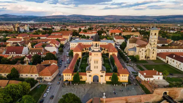 Aerial drone view of Alba Carolina Citadel in Alba-Iulia, Romania. Cityscape, multiple buildings, church, people Aerial drone view of Alba Carolina Citadel in Alba-Iulia, Romania. Cityscape, multiple buildings, church, people