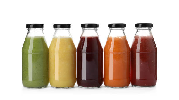 istock Bottles of fresh juices on white background 1365344859