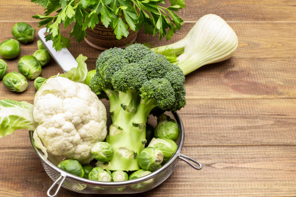 istock Cabbage in colander on wooden background. 1365348901