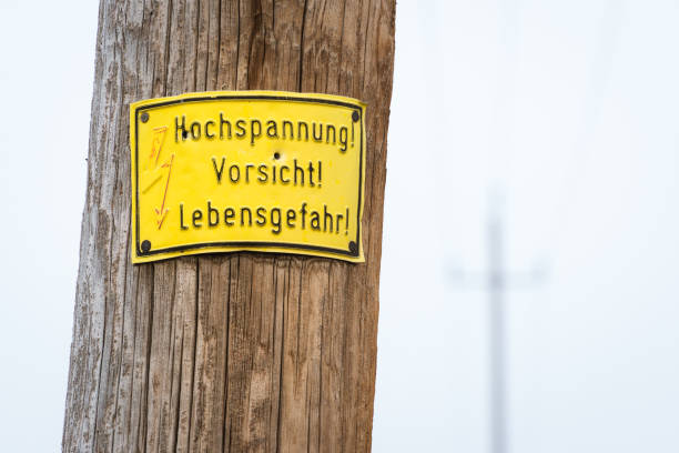 istock Electric pole warning sign in yellow 1365349175