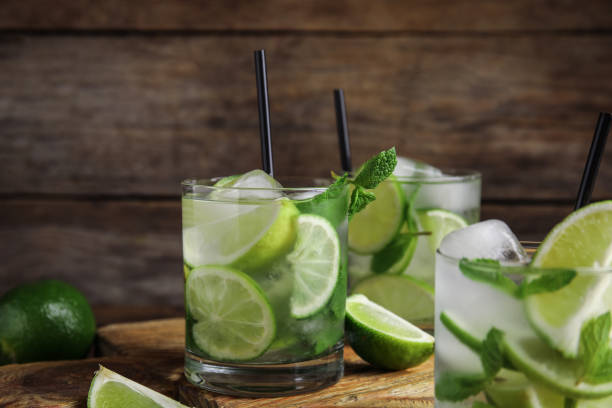 istock Delicious mojito and ingredients on wooden table 1365351455