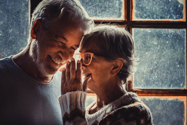 istock Couple Talking By Window At Home 1365352801