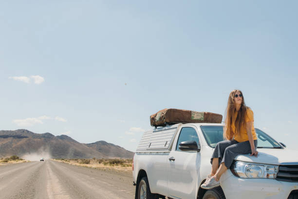 istock Female traveler exploring Namibia by camera truck 1365352990