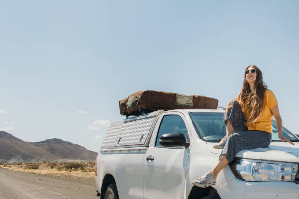 istock Female traveler exploring Namibia by camera truck 1365353015