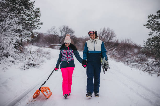 istock A couple in love on the snow is having fun 1365360365