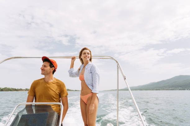 istock Couple taking a boat ride on the sea 1365362156