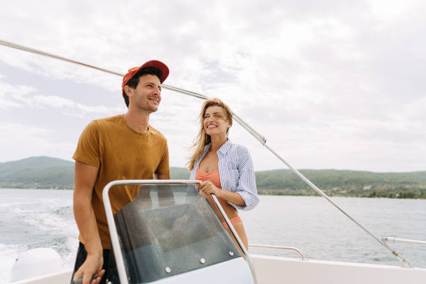 istock Couple taking a boat ride on the sea 1365362234