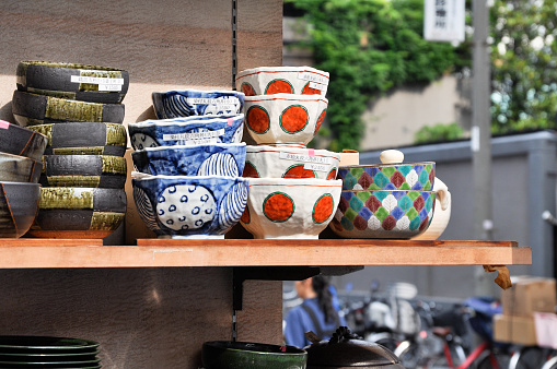 Tokyo, Japan - June 02, 2014: Japanese ceramic cups displayed at one shop in Kappabashi Dori, Taito Ward, Tokyo, Japan. Kappabashi is well known as a shopping street of restaurant and kitchen equipment. It is located between two major touristy areas, Ueno and Asakusa.