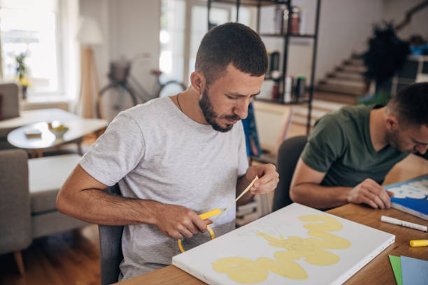 istock Twin male artists working together 1365364099