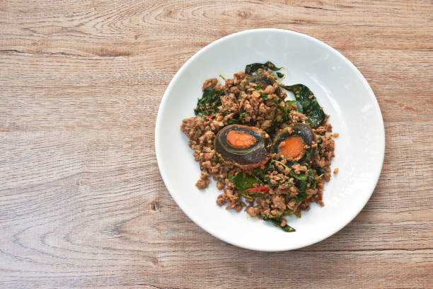 istock slice boiled  black preserved egg dressing spicy fried chop pork and basil leaf 1365364132