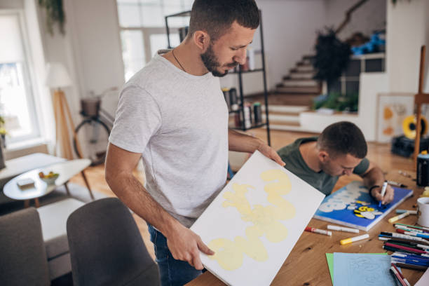 istock Twin male artists working together 1365365383