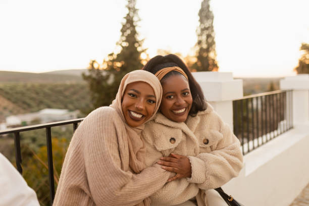 istock Two best friends smiling happily outdoors 1365369025