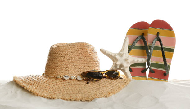 istock Different beach accessories on sand against white background 1365369086