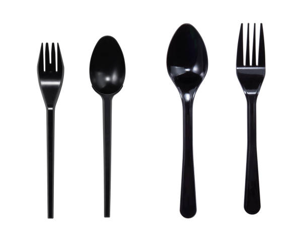 istock Black plastic fork and spoon isolated on white background with clipping path. 1365369781