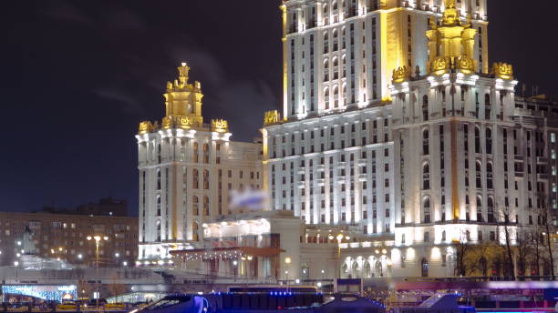 istock Hotel Ukraine winter night timelapse with ship on Moscow River 1365370047