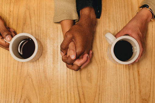 Couple drinking coffee while at lunch