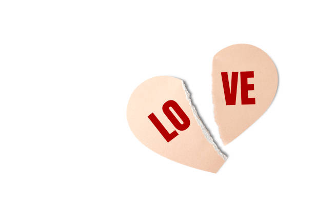 istock broken paper heart. happy valentine's day background. decorative festive object, heart shaped paper on white background. greeting card. holiday banner design. top view. flat lay 1365379572